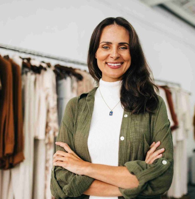 Portrait of a successful boutique owner standing with crossed arms